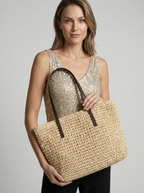 Women's woven straw beach bag with a braided design