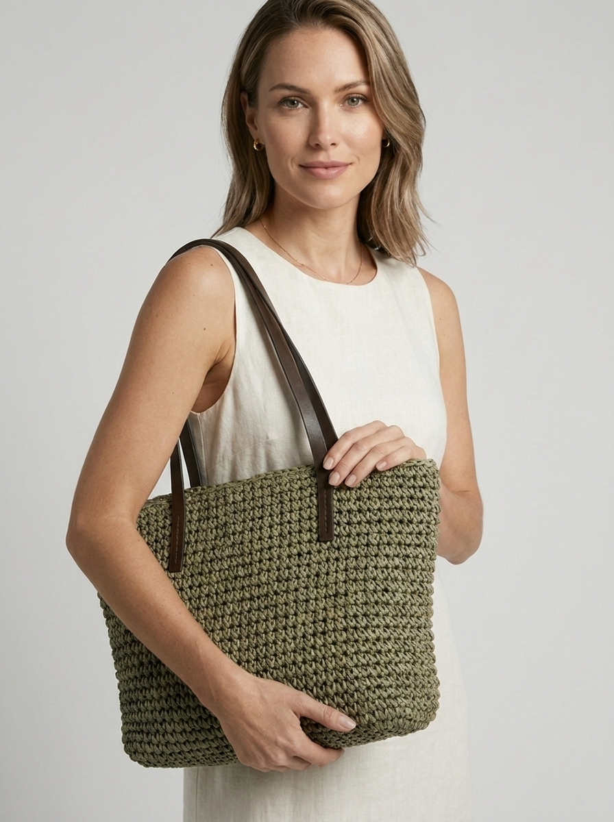 Women's woven straw beach bag with a braided design