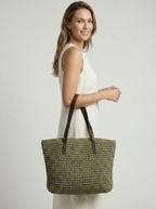 Women's woven straw beach bag with a braided design