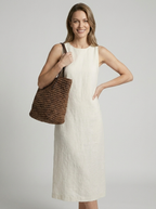 Women's woven straw beach bag with a braided design