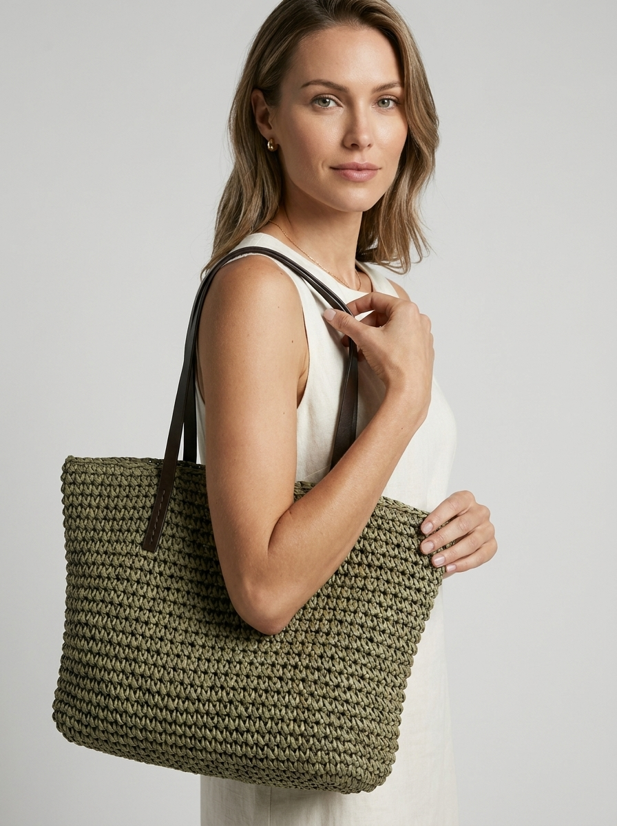 Women's woven straw beach bag with a braided design