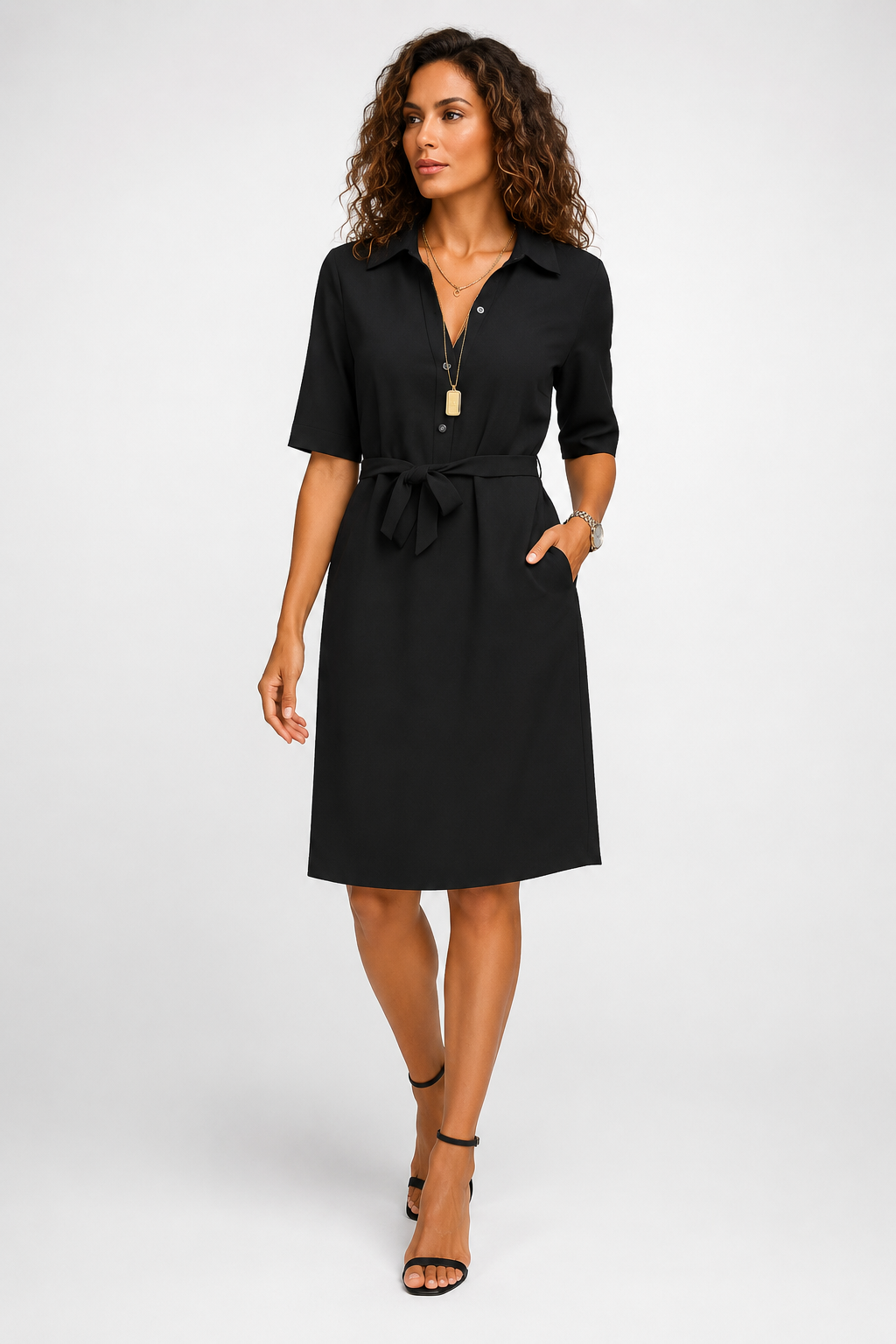 Woman wearing a black dress on a white background