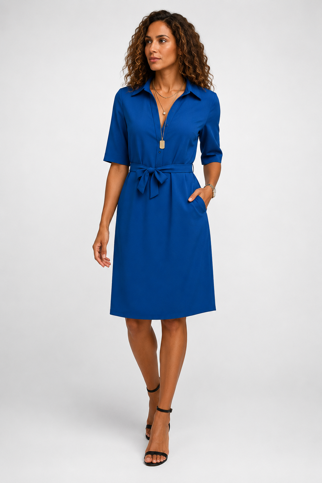 Woman wearing a blue dress on a white background
