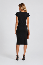 Woman wearing a black dress on a white background