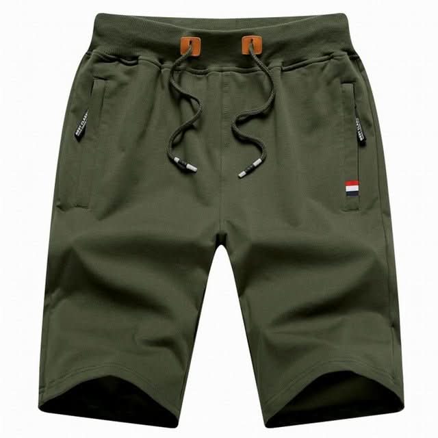 Men's white training shorts with a drawstring waist and zip pockets