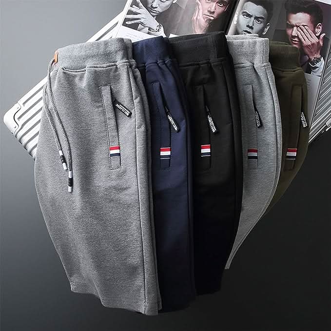 Men's white training shorts with a drawstring waist and zip pockets