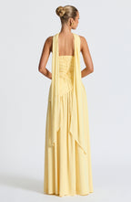 Women's yellow strapless maxi dress with a high front split
