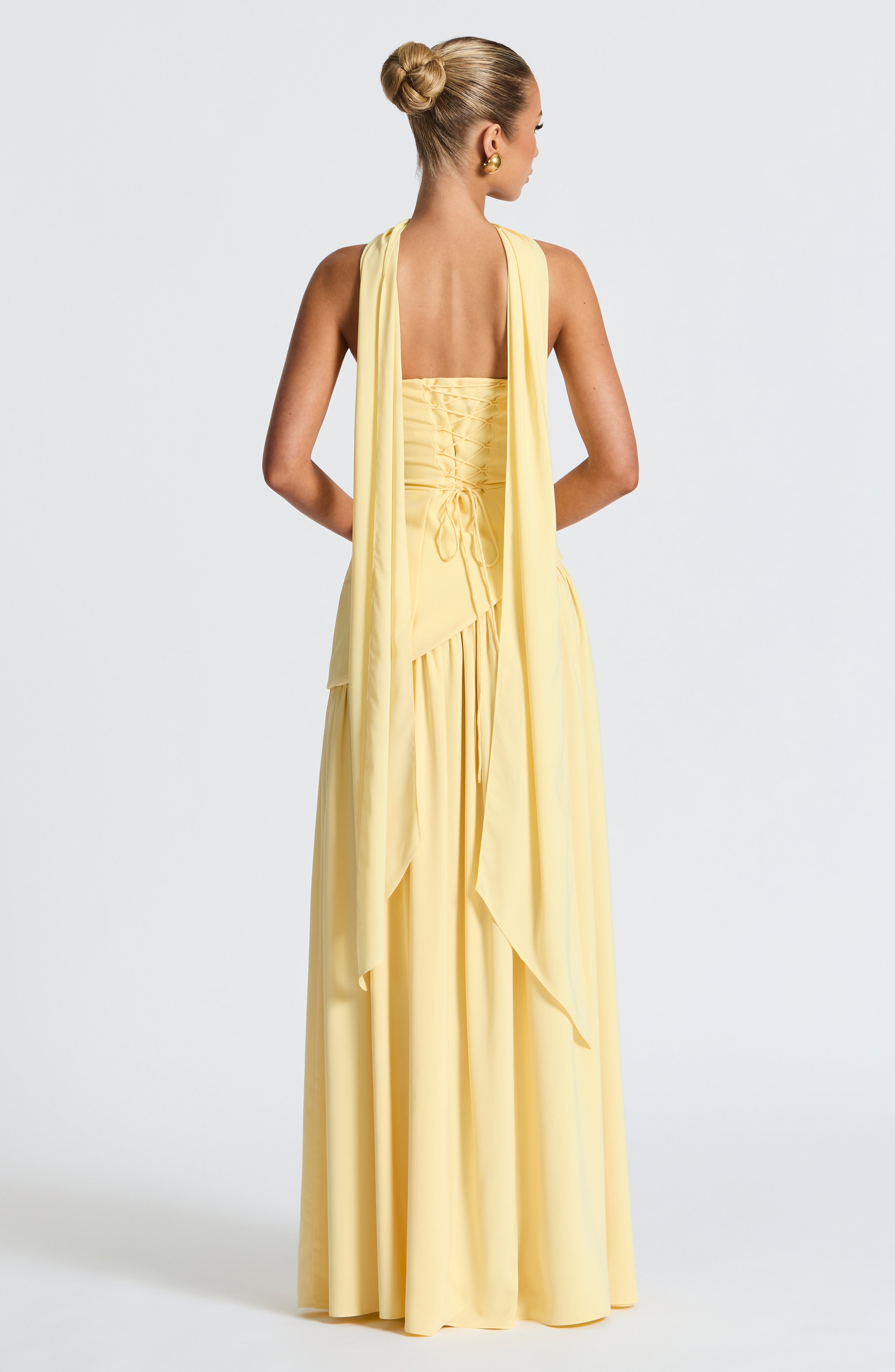 Women's yellow strapless maxi dress with a high front split