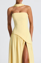 Women's yellow strapless maxi dress with a high front split
