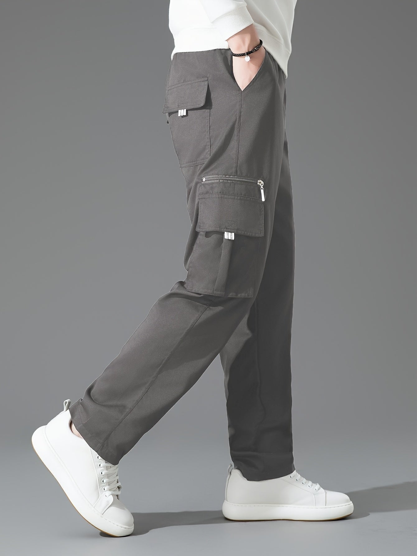 Men's light brown loose fit cargo trousers with multiple pockets