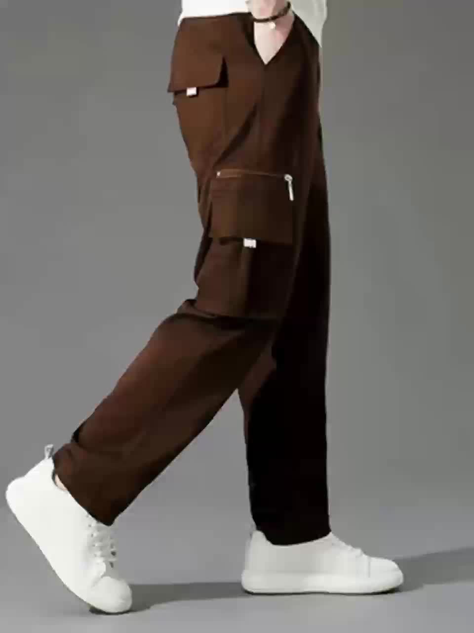 Men's light brown loose fit cargo trousers with multiple pockets