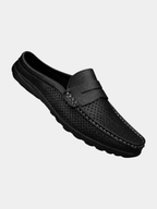 Men's black perforated slip-on loafers with a flexible sole