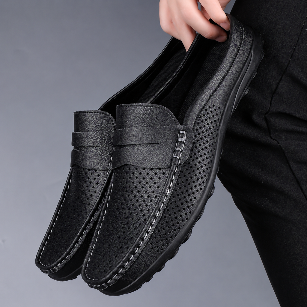 Men's black perforated slip-on loafers with a flexible sole