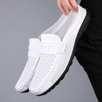 Men's black perforated slip-on loafers with a flexible sole
