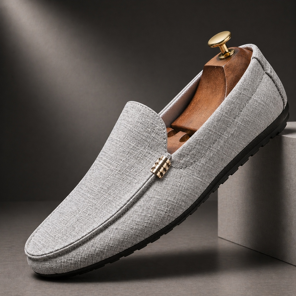 Men's grey slip-on canvas loafers with a flexible sole