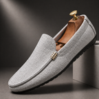 Men's grey slip-on canvas loafers with a flexible sole