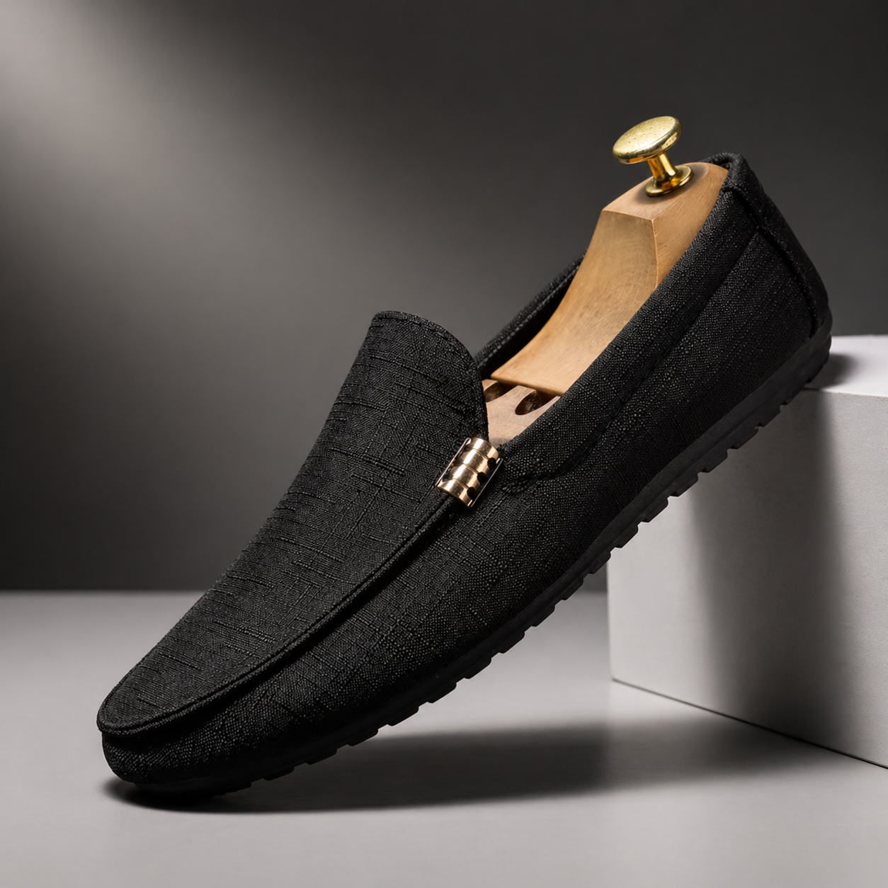 Men's grey slip-on canvas loafers with a flexible sole