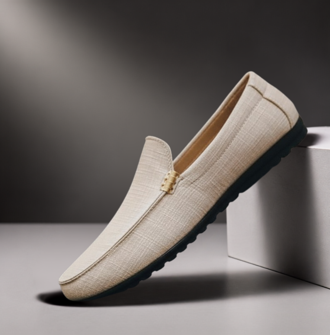 Men's grey slip-on canvas loafers with a flexible sole