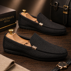 Men's grey slip-on canvas loafers with a flexible sole