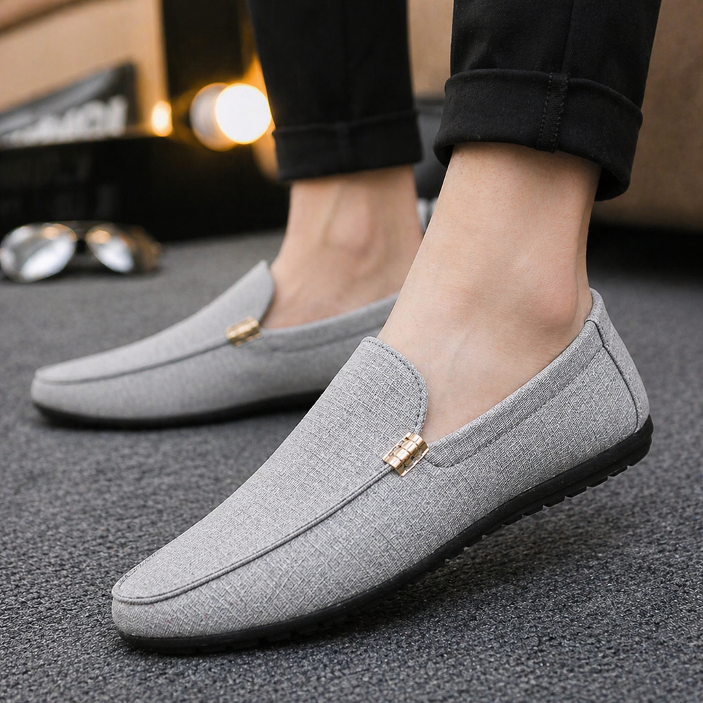 Men's black slip-on canvas loafers with a flexible sole