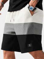 Men's white textured corduroy shorts with a drawstring waist