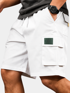 Men's white utility cargo shorts with multiple pockets