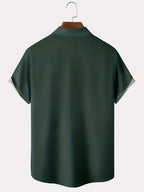 Men's green short sleeve vintage print shirt with a chest pocket