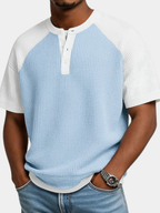 Men's light blue waffle knit polo shirt with a button placket