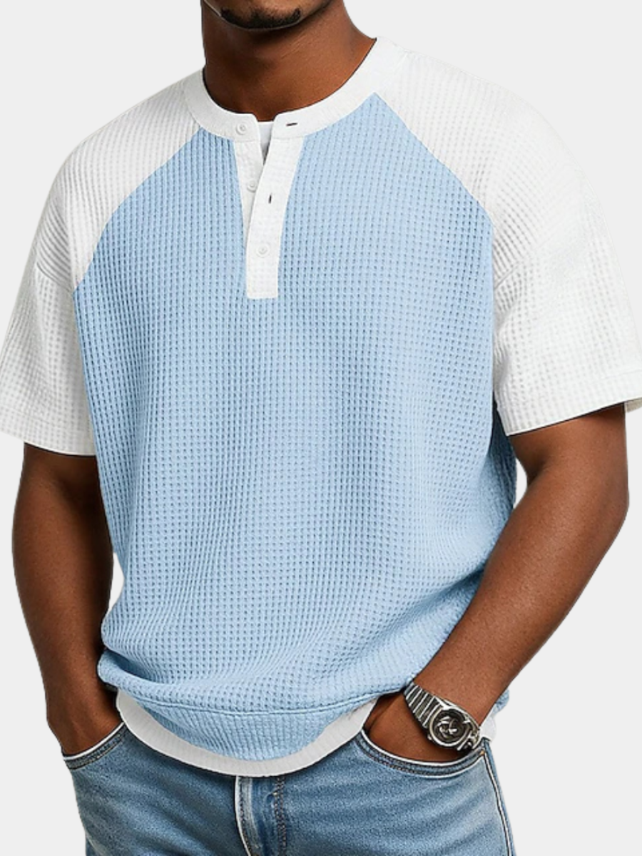 Men's light blue waffle knit polo shirt with a button placket